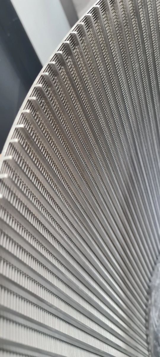 Close-up of stainless steel wedge wire screen with precision slot openings
