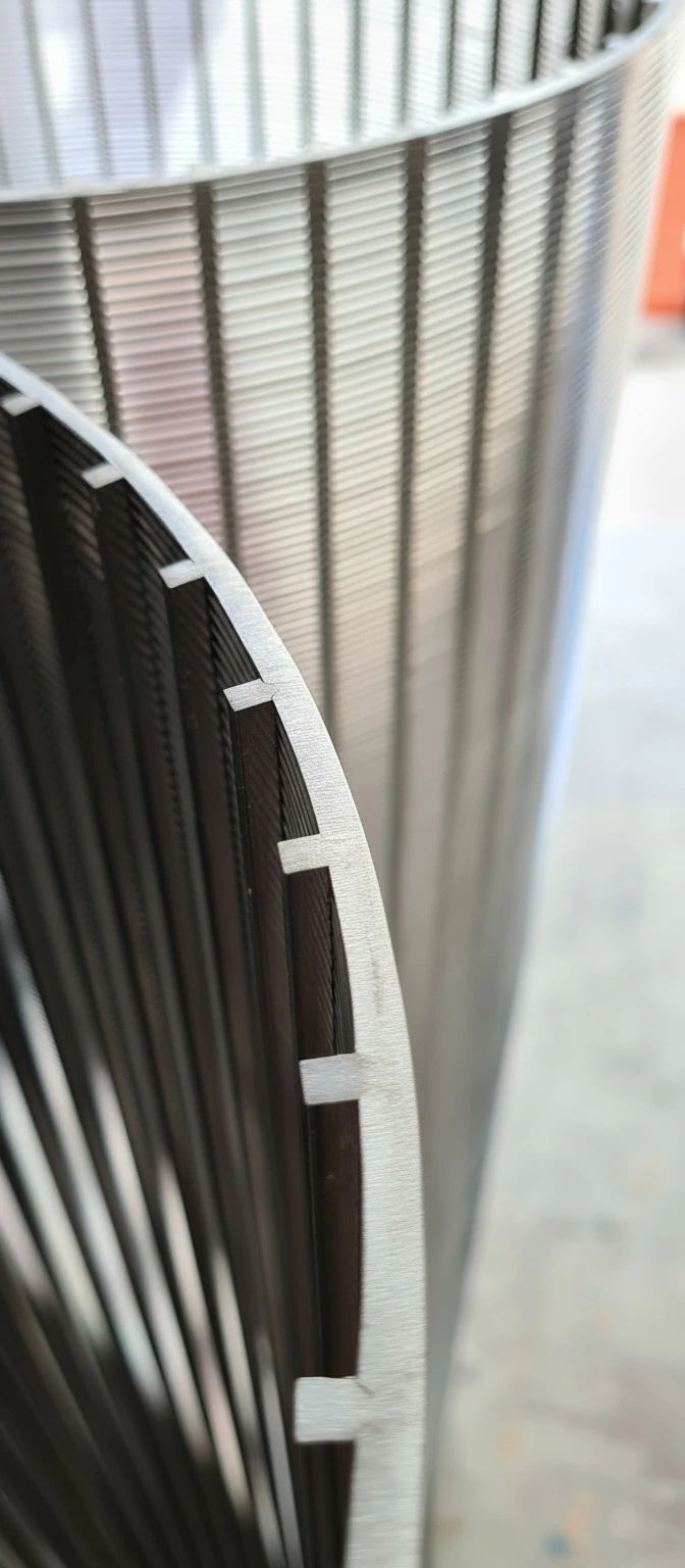 Close-up of stainless steel wedge wire screen showing V-wire profile and precision-welded slots